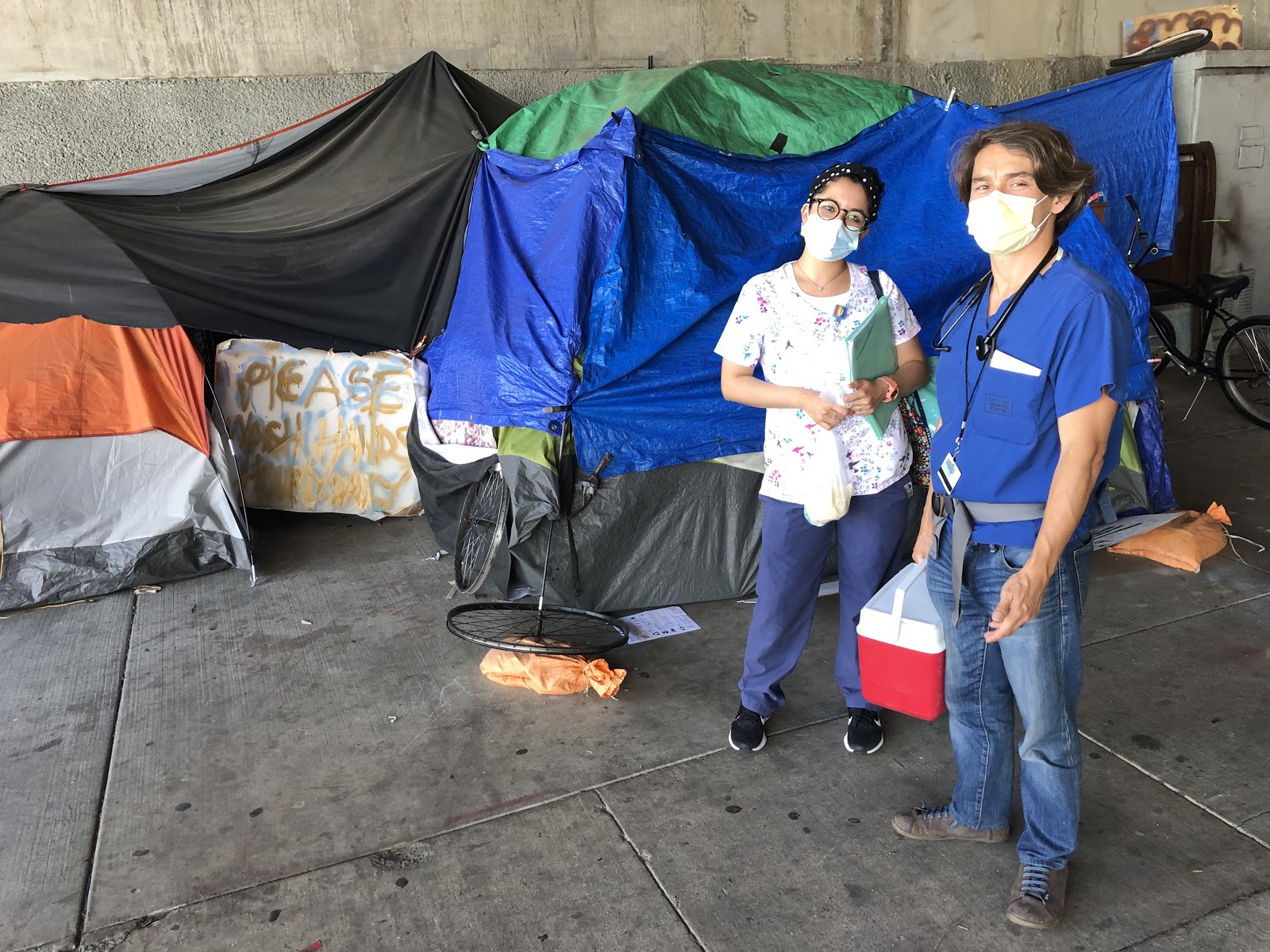 Figure 14.  Dr. Gilmore Chung and Medical Assistant III, Letty, go to the people under the bridge with vaccinations. Taken by Dr. Coley King of Venice Family Clinic.