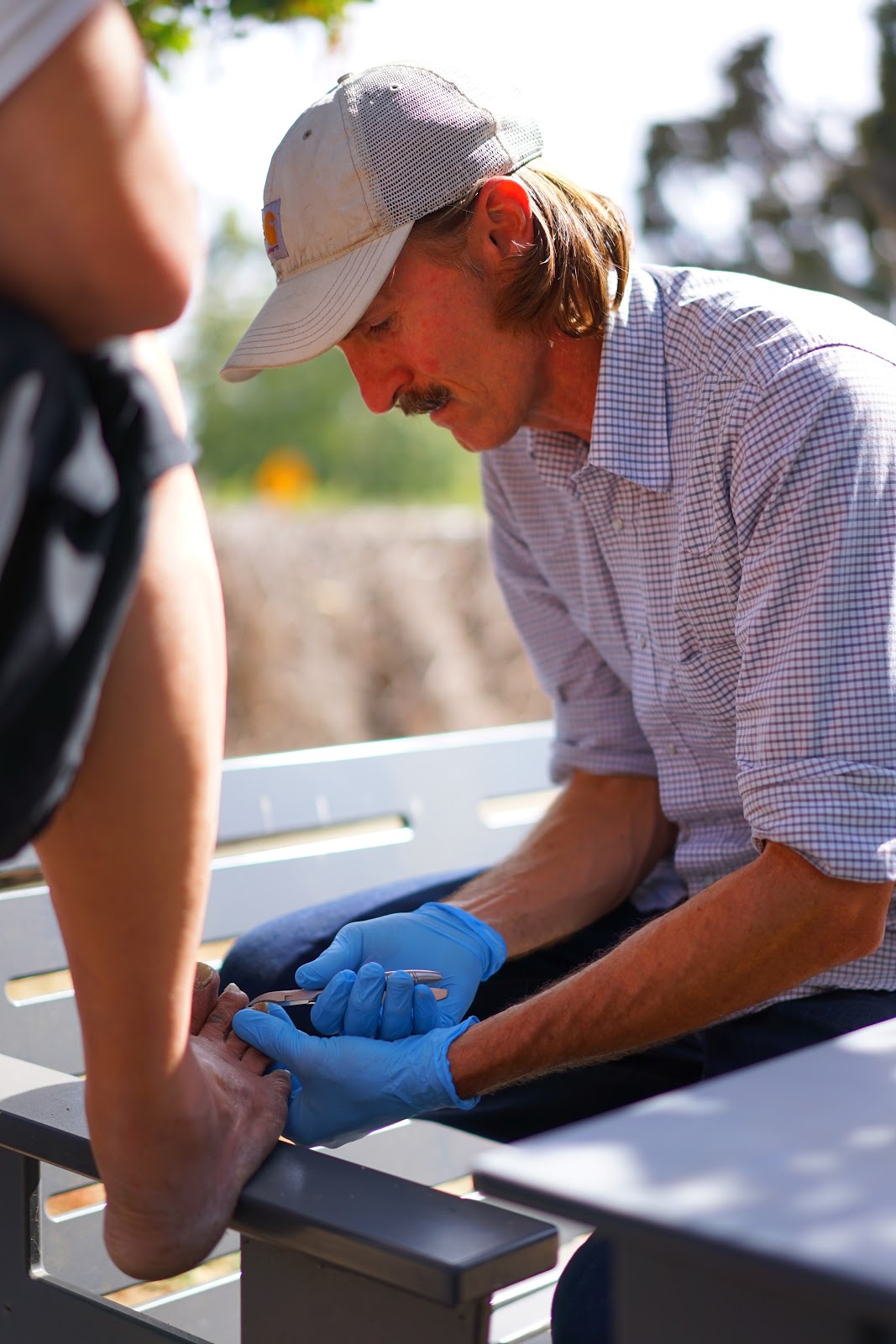 Figure 23.  Foot care is a useful service that can alleviate discomfort and support a trusting relationship.  Taken by Peter Miller.