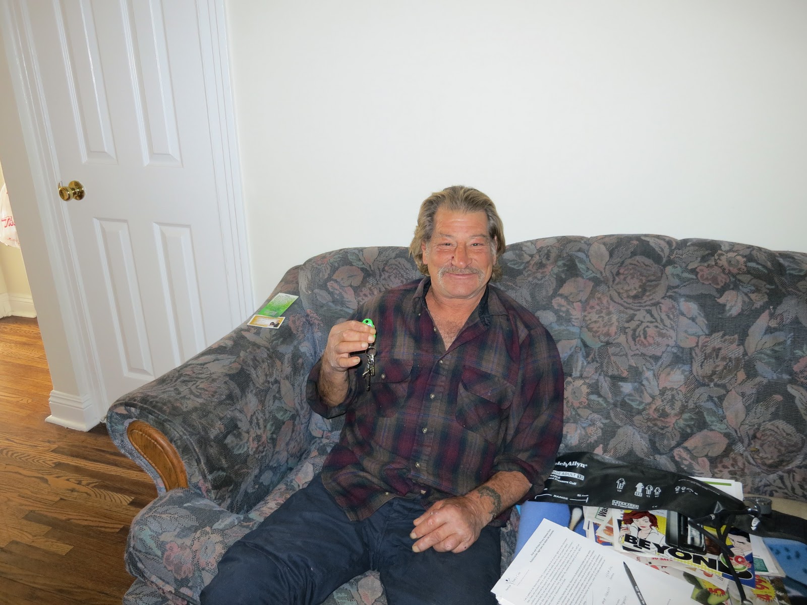 Figure 33.  A recently housed patient proudly displays his keys. Taken by Carrie Kowalski of Venice Family Clinic.