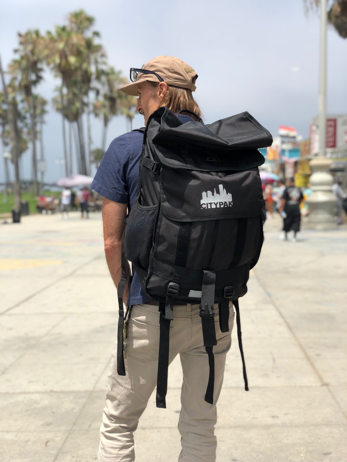 Dr. King with a Citypak on the Venice Beach Boardwalk. Citypak, a nonprofit, has donated countless backpacks for the unsheltered people on and near Venice Beach. Venice Family Clinic Photos. 