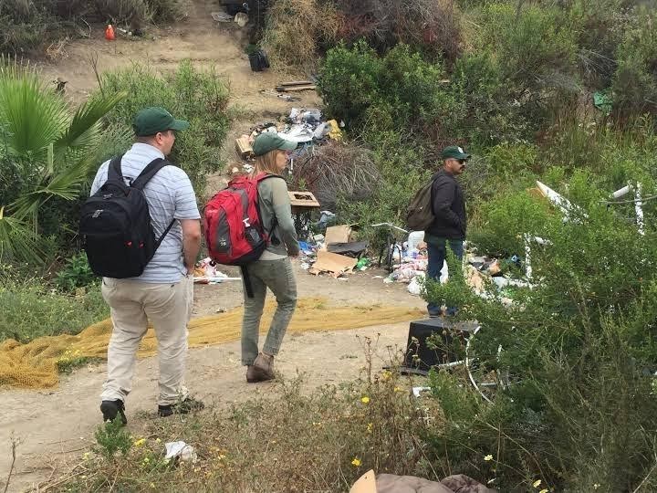 The team carefully navigates an encampment. Taken by Andrea Murray of St. Joseph Center.  