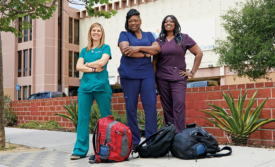 Carrie Kowalski, PA-C, Lachune Price, PA-C, and Ebony Funches DNP, of Venice Family Clinic show off their street medicine attire and backpacks. Cedars Sinai Photos.