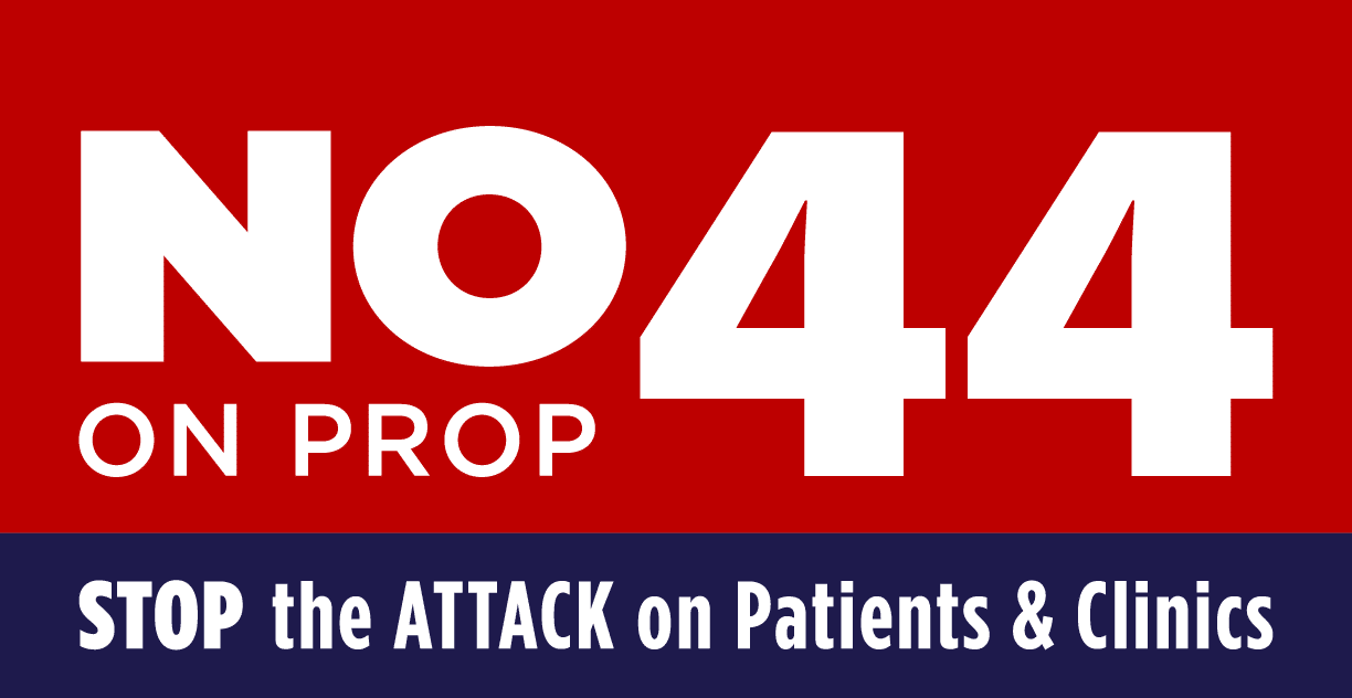 Red And Blue Sign Reads: NO 44 On PROP. STOP The ATTACK On Patients & Clinics. The Text Is Bold With 44 In Large Font And STOP The ATTACK Emphasized In White And Blue. Red And Blue Sign Reads: NO 44 On PROP. STOP The ATTACK On Patients & Clinics. The Text Is Bold With 44 In Large Font And STOP The ATTACK Emphasized In White And Blue.